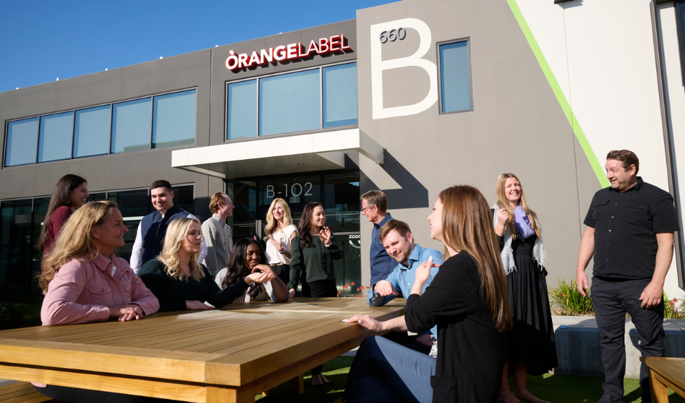 Orange Label team having a meeting outside their office